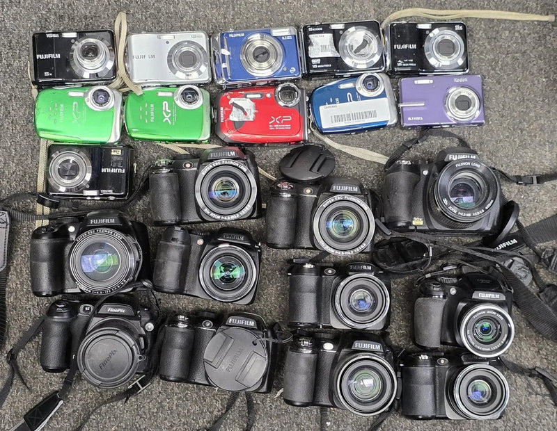 Mixed-model digital camera lot with multiple compact cameras, some with screens and lenses