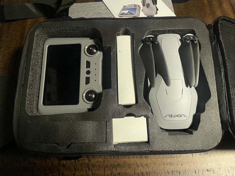 Drone kit in hard case with controller and spare battery