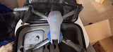 Aircraft drone with front camera, blue LED, in open carrying case