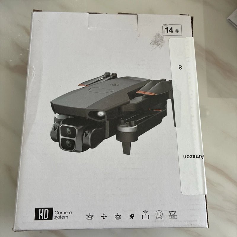 4K camera drone, gray quadcopter with front camera and folded propellers in box