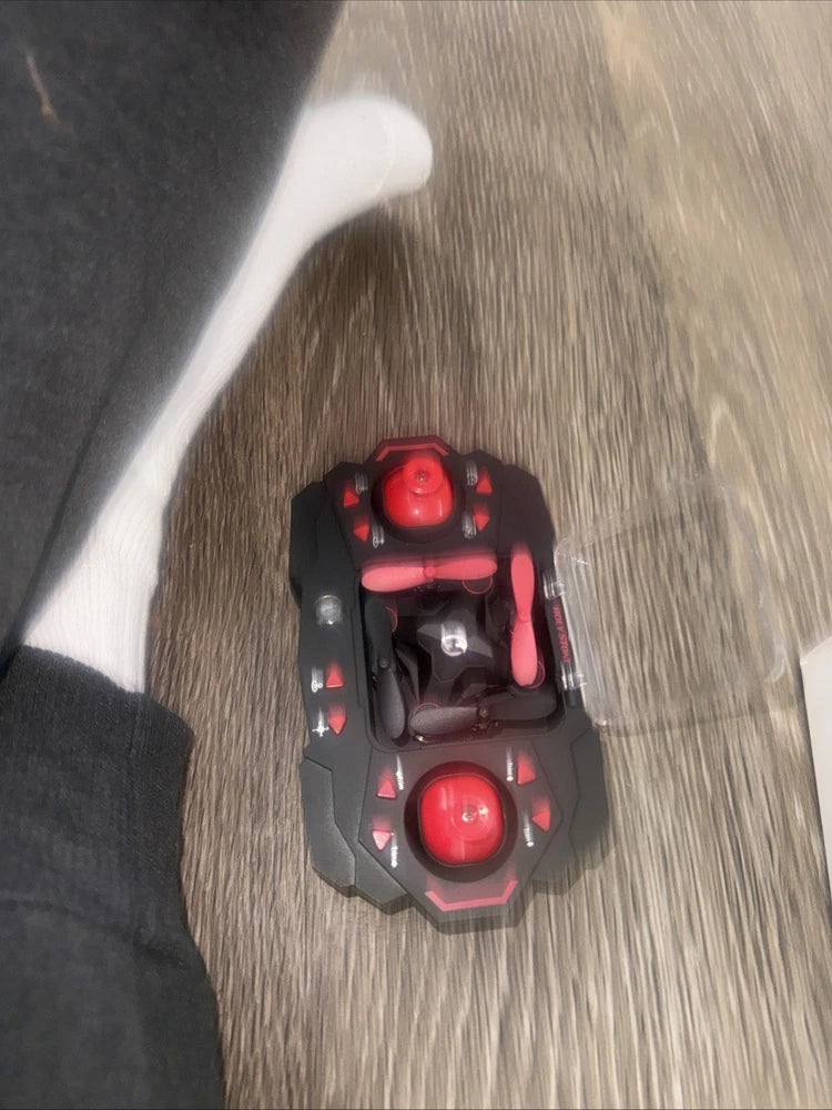 Mini drone with red LED lights and black body, compact handheld size