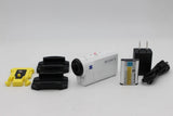 Sony white action camera with battery, charger, cables, and mounting accessories