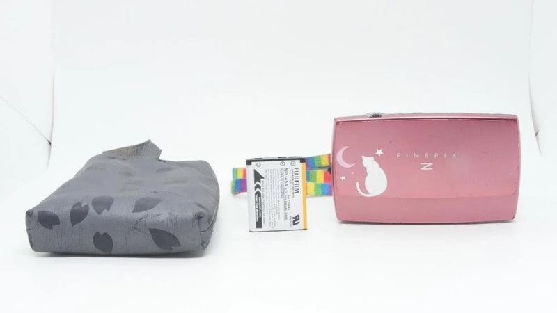 Pink FUJIFILM Finepix Z2000 compact digital camera with gray storage pouch