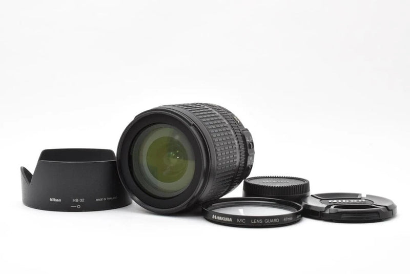 Nikon AF-S 18-105mm zoom lens with hood, front cap, and rear cap