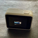 GoPro HERO7 gray waterproof action camera, front screen with GoPro logo