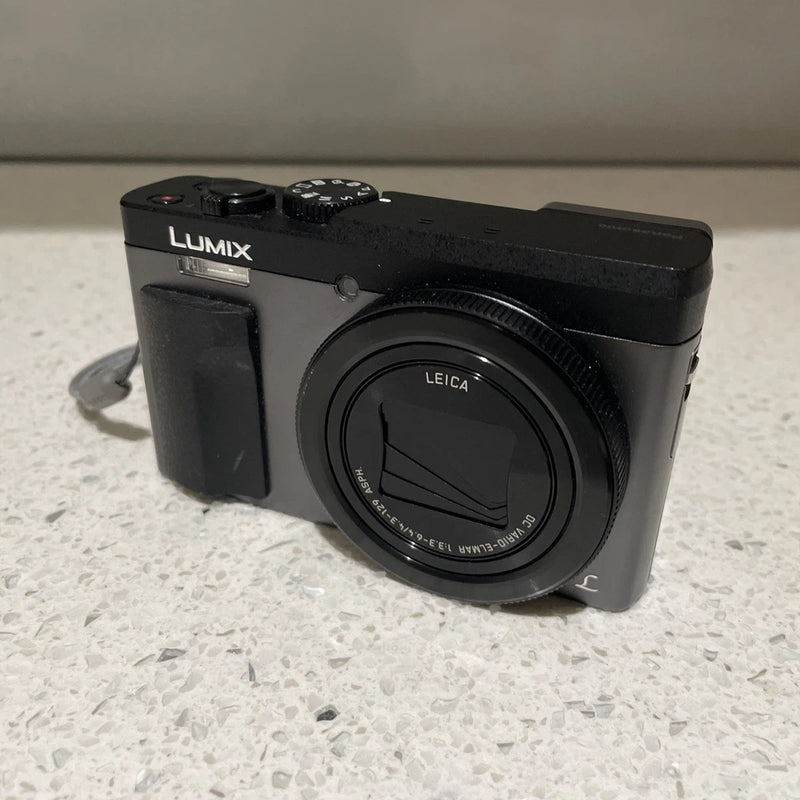 Black Panasonic Lumix digital camera with Leica lens and top control buttons
