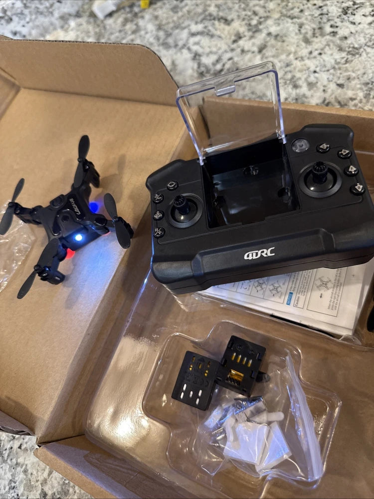 Folding pocket mini drone with remote controller and spare parts in clear bag