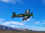 RC model airplane kit: dark blue fighter plane with green markings, propeller nose