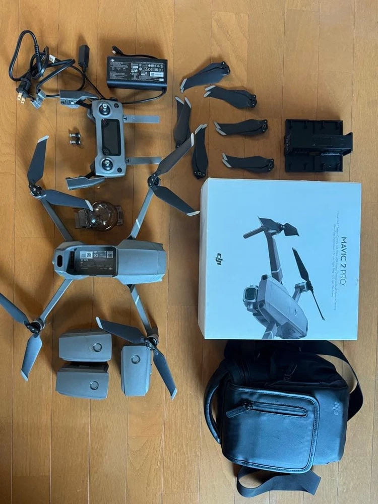 Quadcopter drone kit with controller, spare batteries, and carrying case