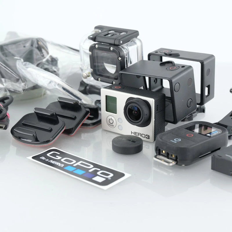GoPro HERO3 action camera in protective housing with mounts and accessories, black and silver