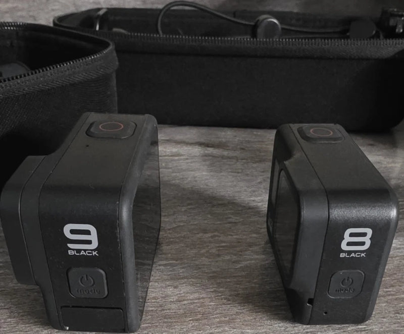 GoPro HERO9 and HERO8 Black waterproof action cameras, front views with power buttons