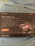 Mini drone retail box with orange quadcopter illustration and specs on the front