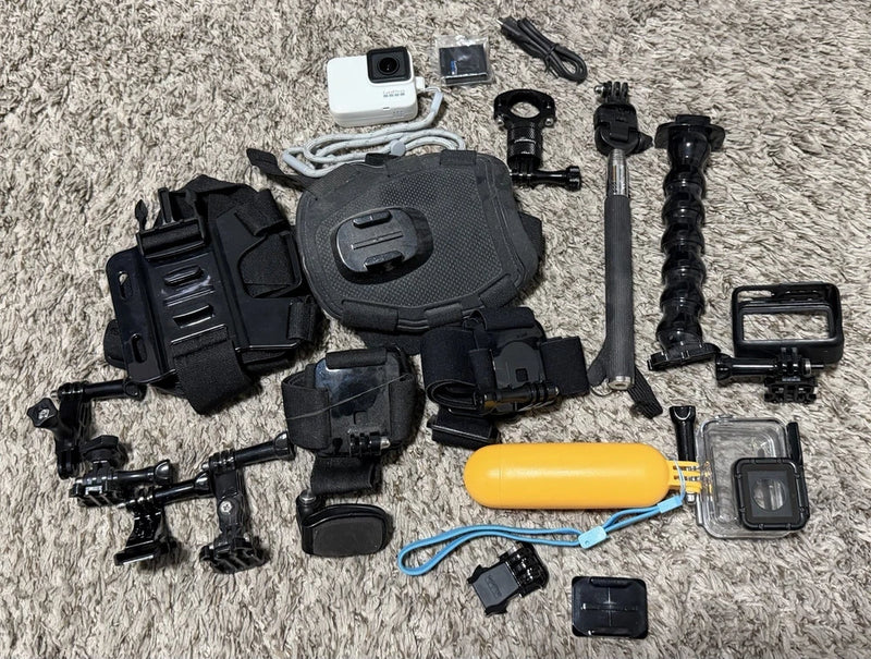 Black action camera bundle with mounts, waterproof case, and accessories