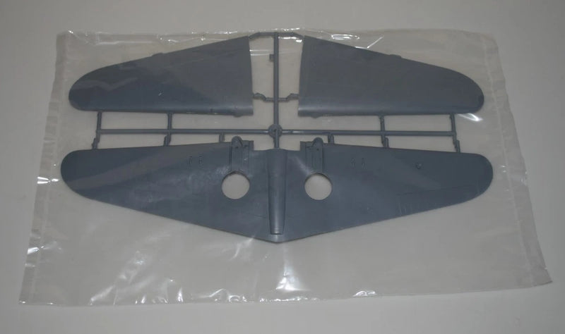 Aircraft model sprue wing parts, dark blue-gray with two circular cutouts