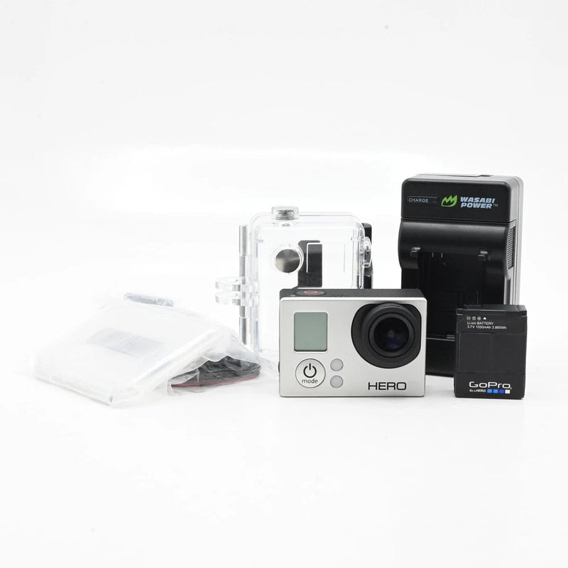 GoPro Hero action camera with clear waterproof housing and black charging dock