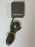 Game Boy Advance battery power supply charger with attached cable and plug