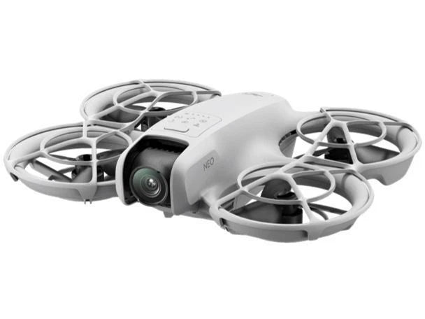 White mini drone with front camera and four foldable propellers