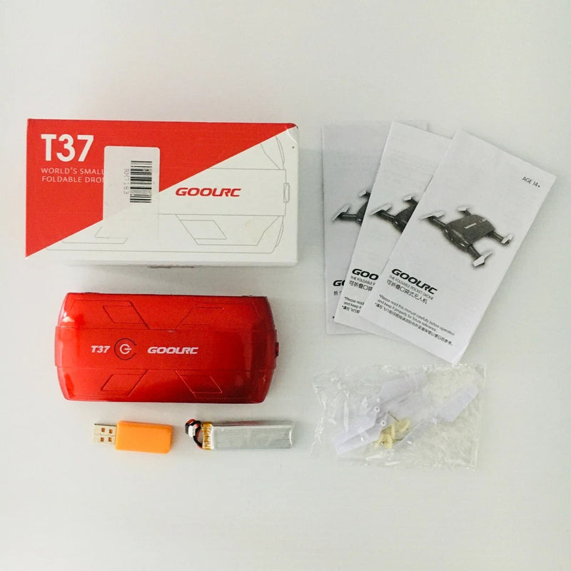 Red foldable mini selfie drone kit with T37 box and USB charging accessories
