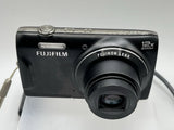 Black Fujifilm compact digital camera with front FUJINON 12x zoom lens