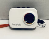 White Polaroid waterproof action camera with round lens and side strap
