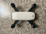 DJI Spark drone with white body and black propeller arms