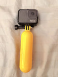 GoPro HERO7 Black Waterproof Action Camera with yellow floating handgrip