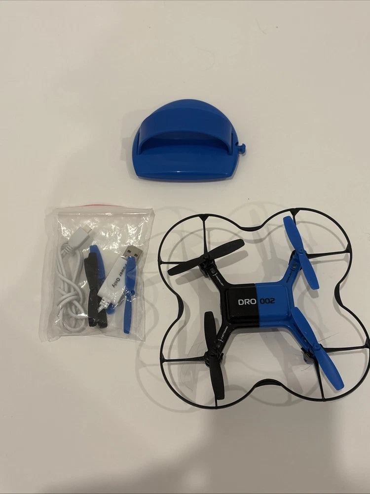 Blue RC stunt drone with hand controller, four propellers and accessories bag