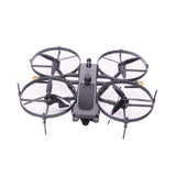 Quadcopter drone kit with four propeller arms and gray central body, antennas