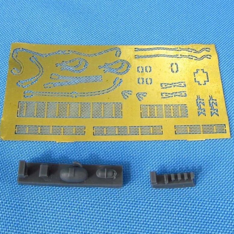 Scale model wheel bay resin parts and PE photo-etch fret on yellow sheet