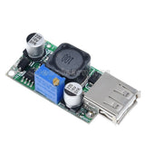 USB DC-DC boost converter module with blue capacitor and two silver electrolytic caps