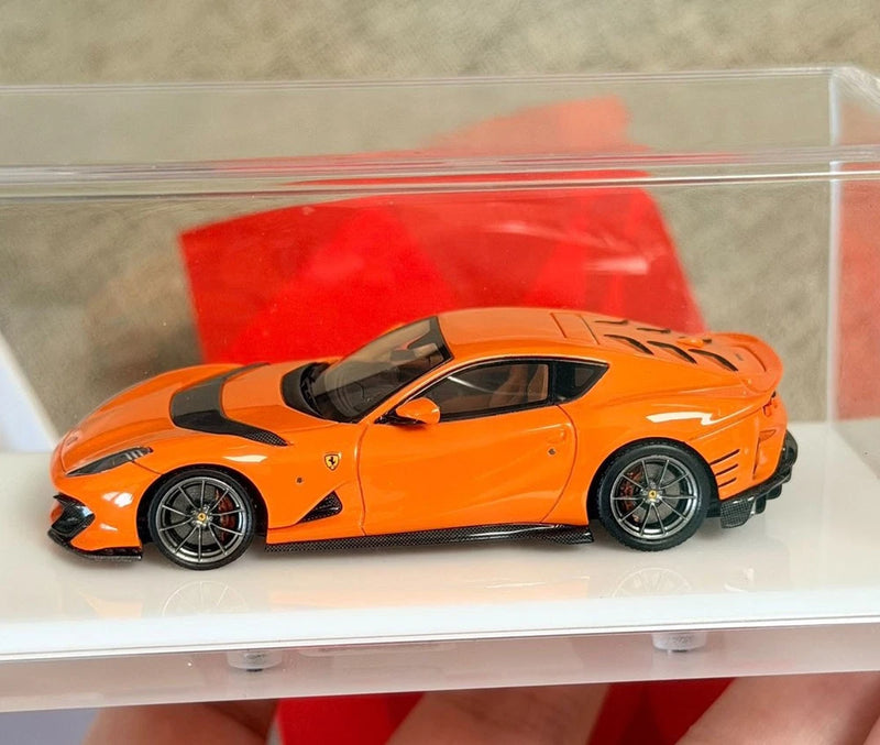 FuelMe 1:64 resin Ferrari 812C orange model car in clear display case, side view
