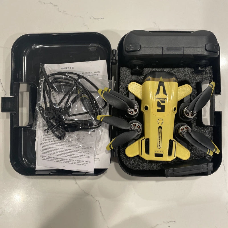 Yellow RC quadcopter drone with foldable propellers, in open carrying case