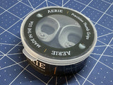 Round container with two gray drone thumb grips