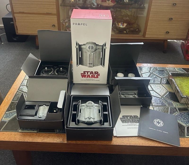 Propel Star Wars TIE Advanced x1 drone with open black retail box and accessories