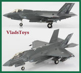 Gray F-35A model aircraft with landing gear, shown in side view on display stand