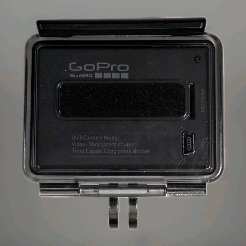GoPro Hero action camera in clear waterproof case with side buttons and latch