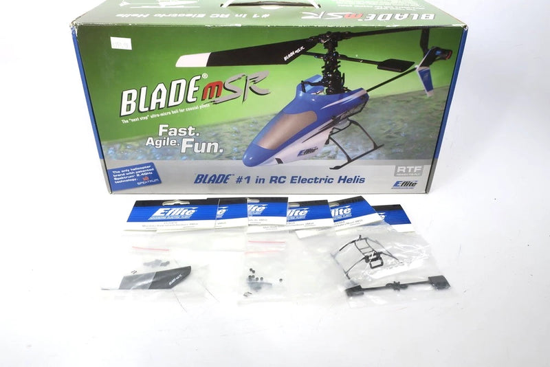 RC helicopter kit, Blade MSR parts and main rotor assembly in retail box