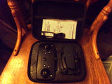 Black hard case with foldable drone and accessories, open view