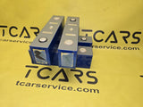 Blue LiFePO4 battery cells with metal terminals, three stacked blocks