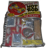 Electric hot rod wood model kit in blister pack with wheels, bracket, and small parts
