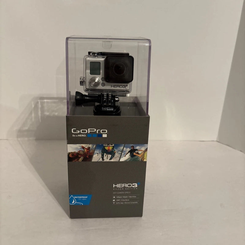 Silver and black waterproof action camera in retail box with GoPro HERO3+ branding
