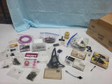 Assorted RC helicopter parts in plastic bags and boxes, including rotor and tools