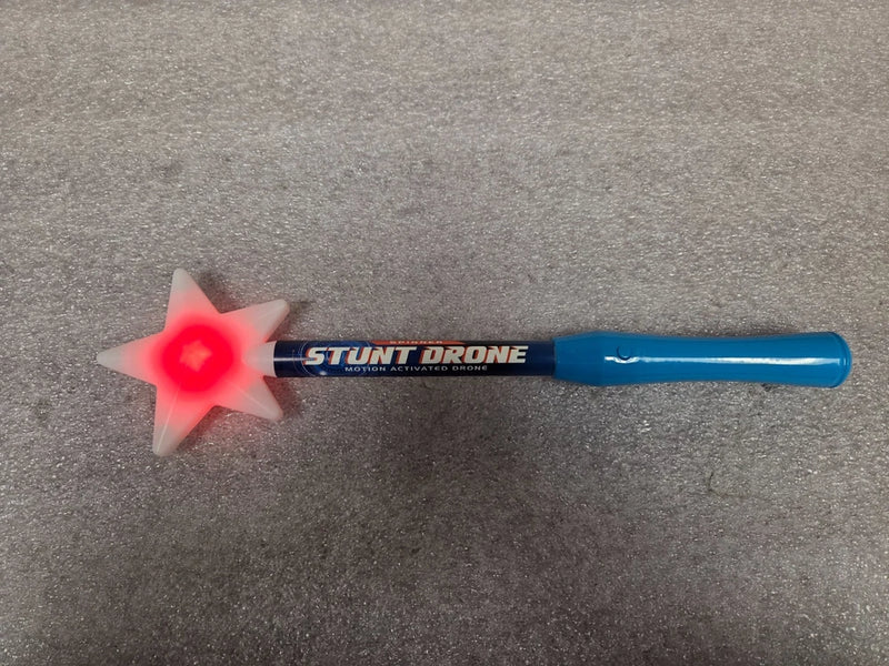 Motion-activated stunt drone with blue body and glowing red star light