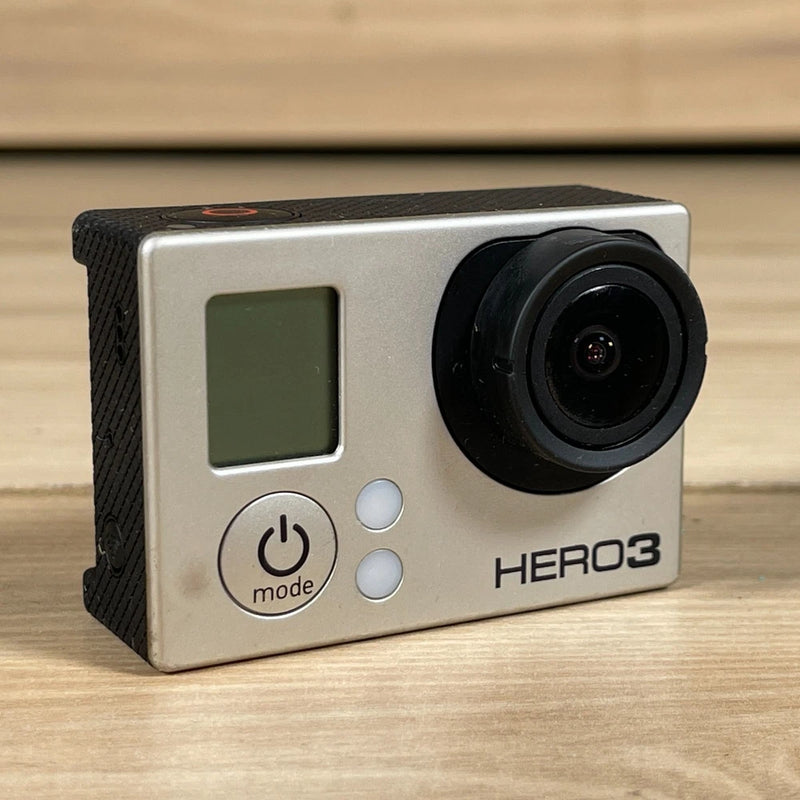 GoPro HERO3 action camera with silver body, black lens, front LCD and mode button