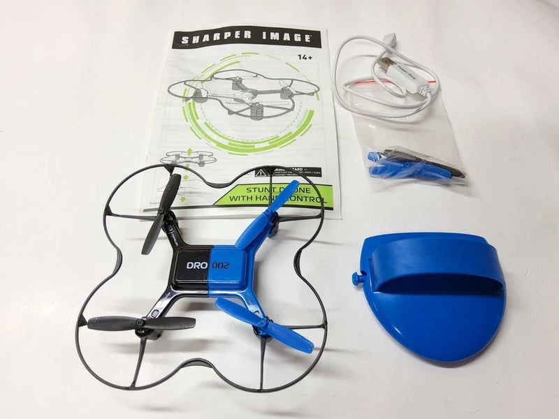 Blue R/C quadcopter stunt drone with hand controller and spare parts