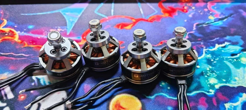 Brushless FPV drone motors with mounting hardware, four circular housings