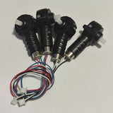 Drone motor set with four black motors, metal shafts, and colored wiring harness