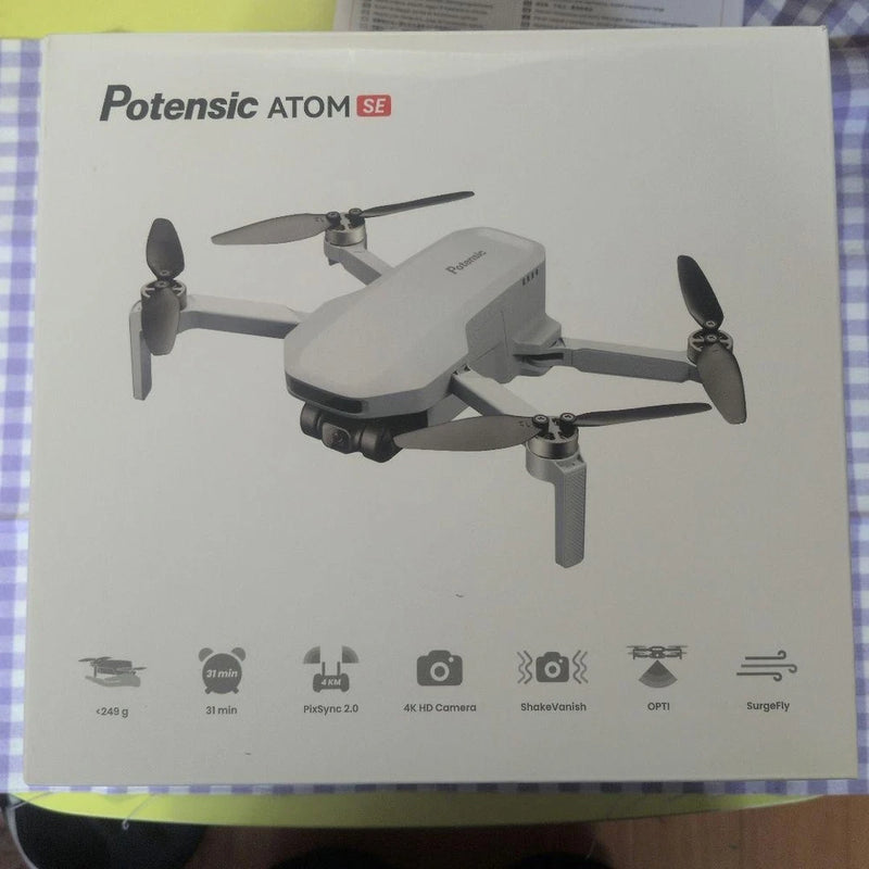 Foldable white quadcopter drone with four rotors