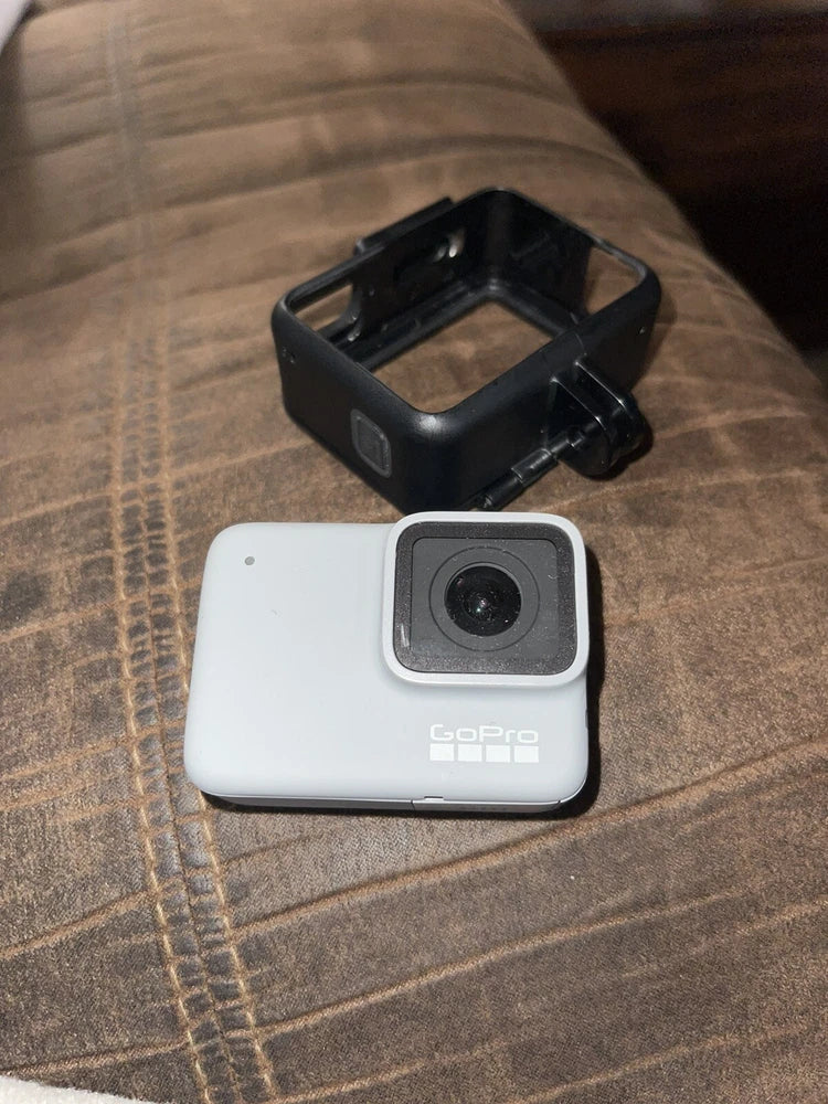 White GoPro HERO7 waterproof digital action camera with black protective frame