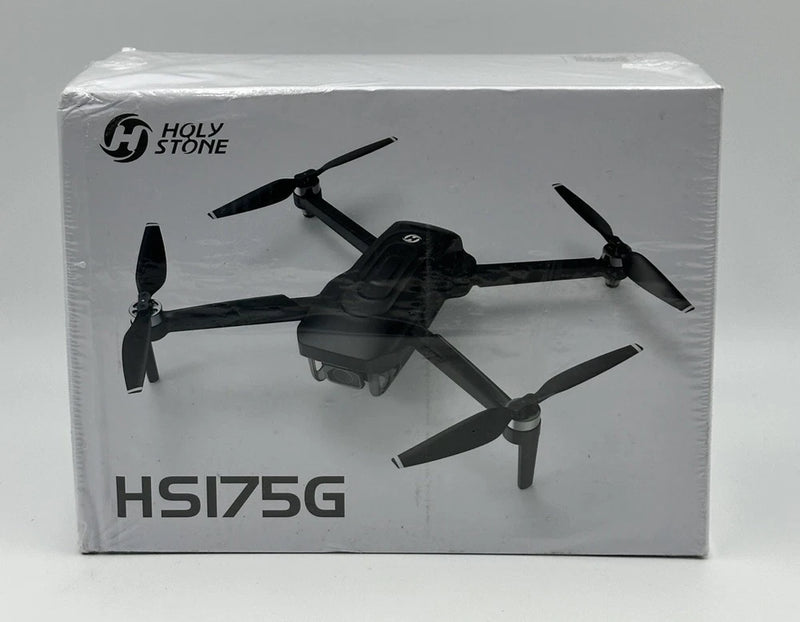 Black foldable GPS drone with four propellers, in retail box